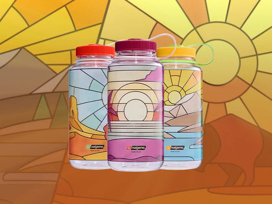 Three vibrant water bottles from Nalgene's limited edition Stained Glass collection, showcasing unique colorful designs.